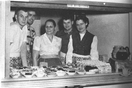 Cafeteria worker and students circa 1960s
